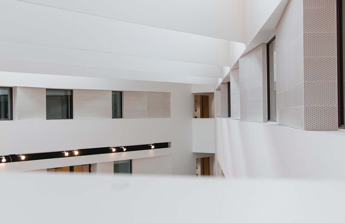 interior design photography of white concrete building during daytime indoors